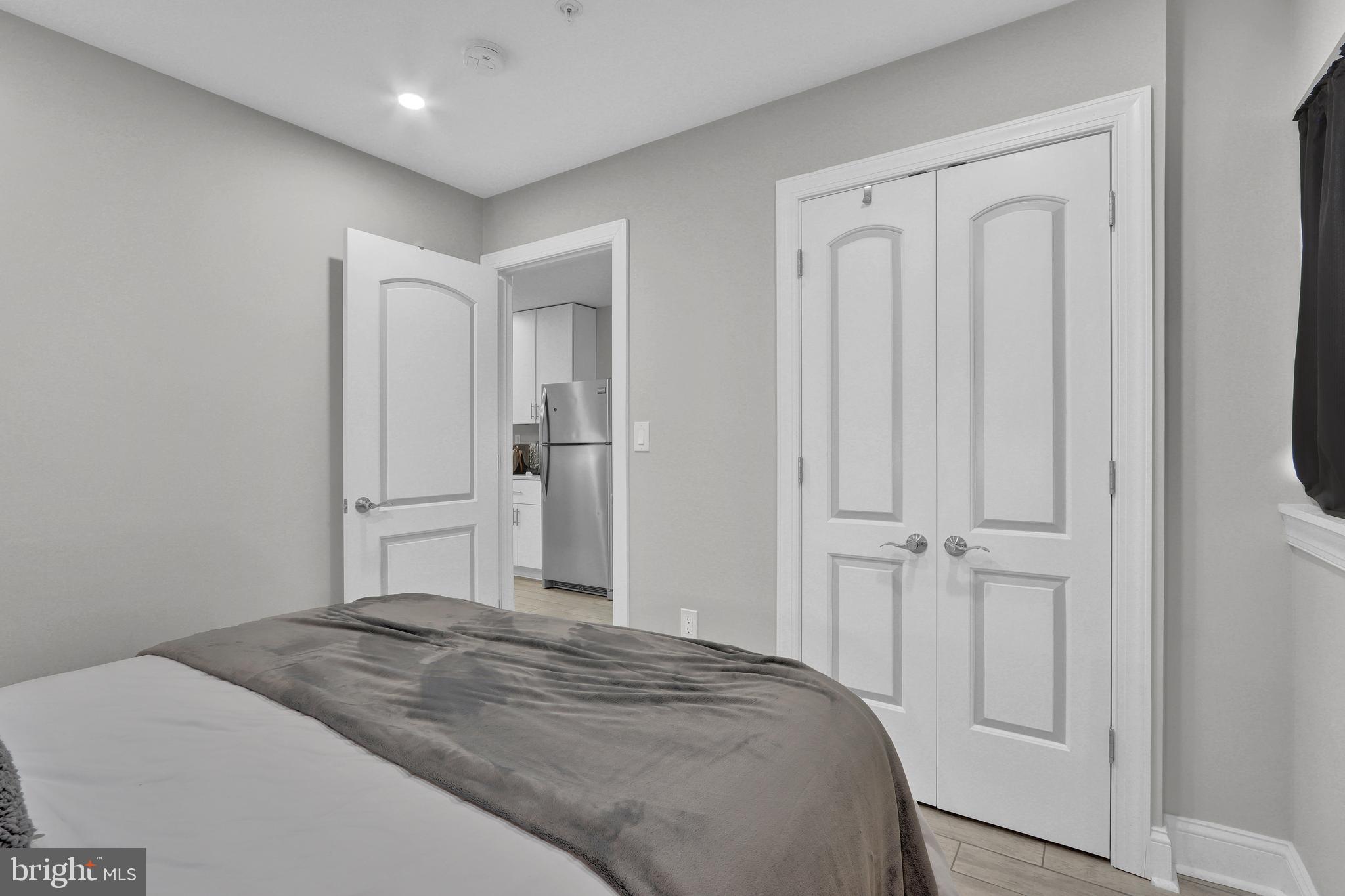 1167 Morse Street Northeast, Unit B1 Washington, DC 20002 - Photo 15 of 18 a bedroom with a bed and a cabinet