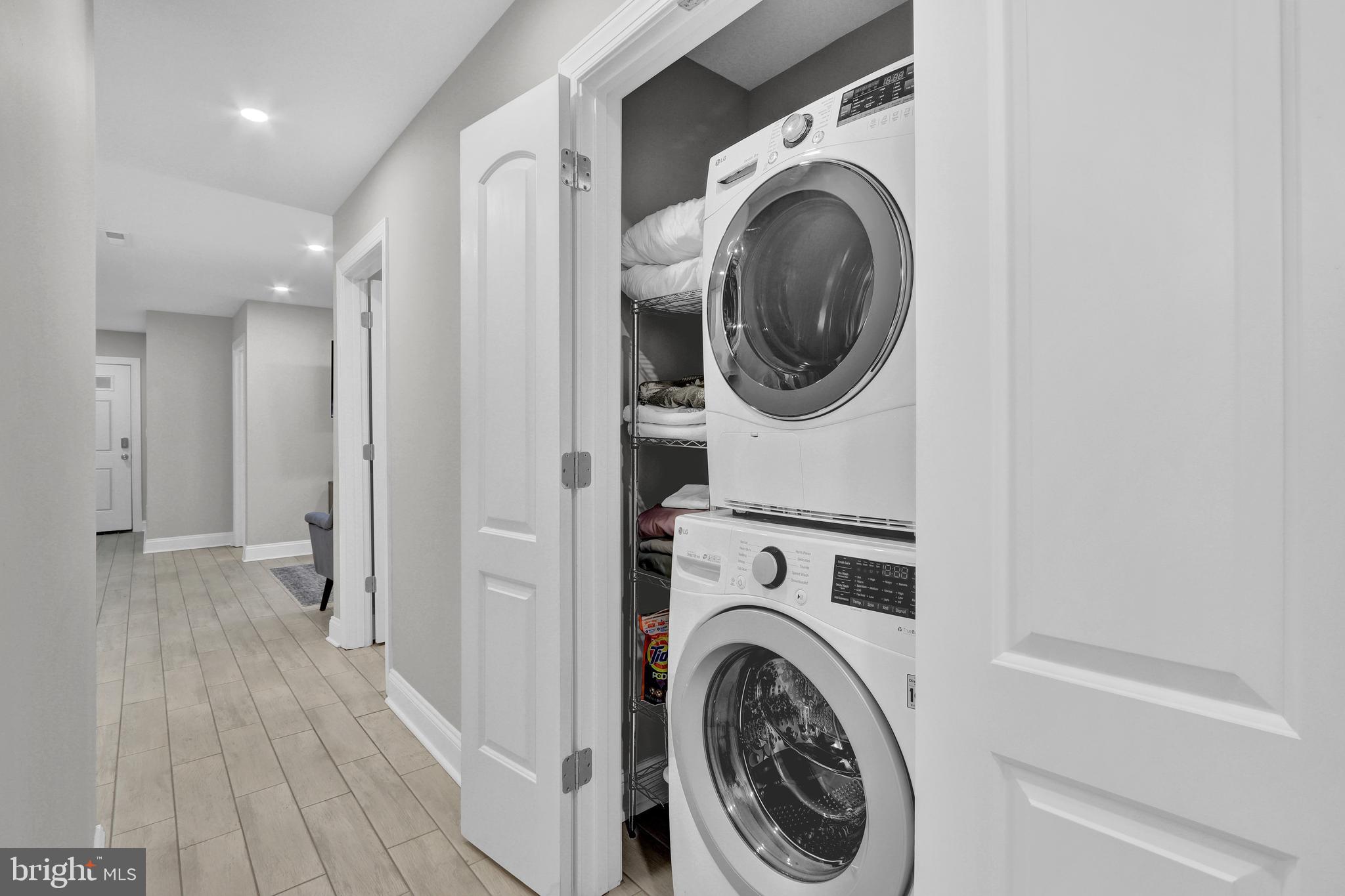 1167 Morse Street Northeast, Unit B1 Washington, DC 20002 - Photo 16 of 18 a view of a hallway with washer and dryer