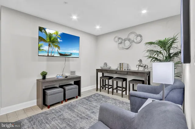 a living room with furniture a piano and a flat screen tv
