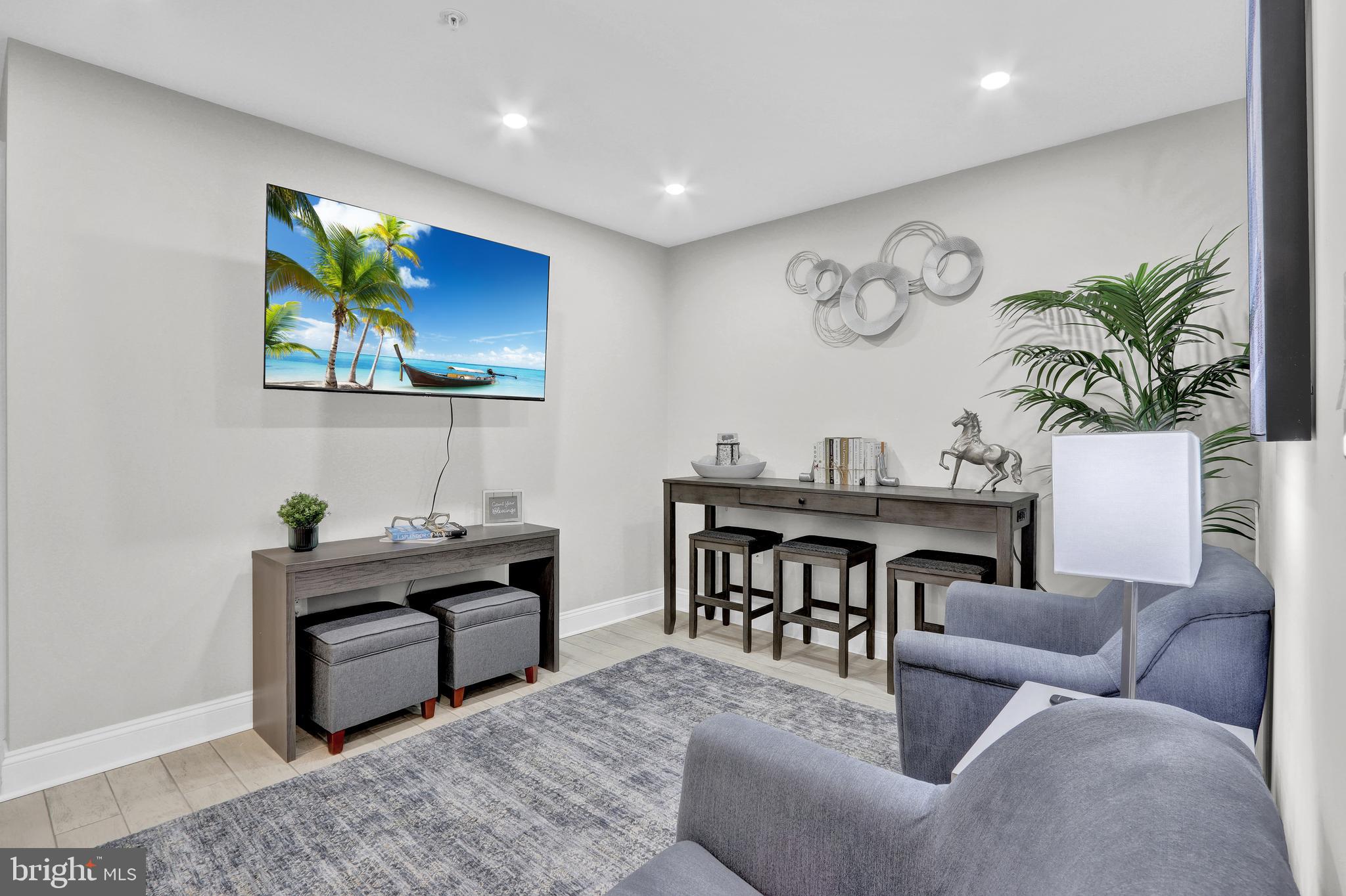 1167 Morse Street Northeast, Unit B1 Washington, DC 20002 - Photo 5 of 18 a living room with furniture a piano and a flat screen tv