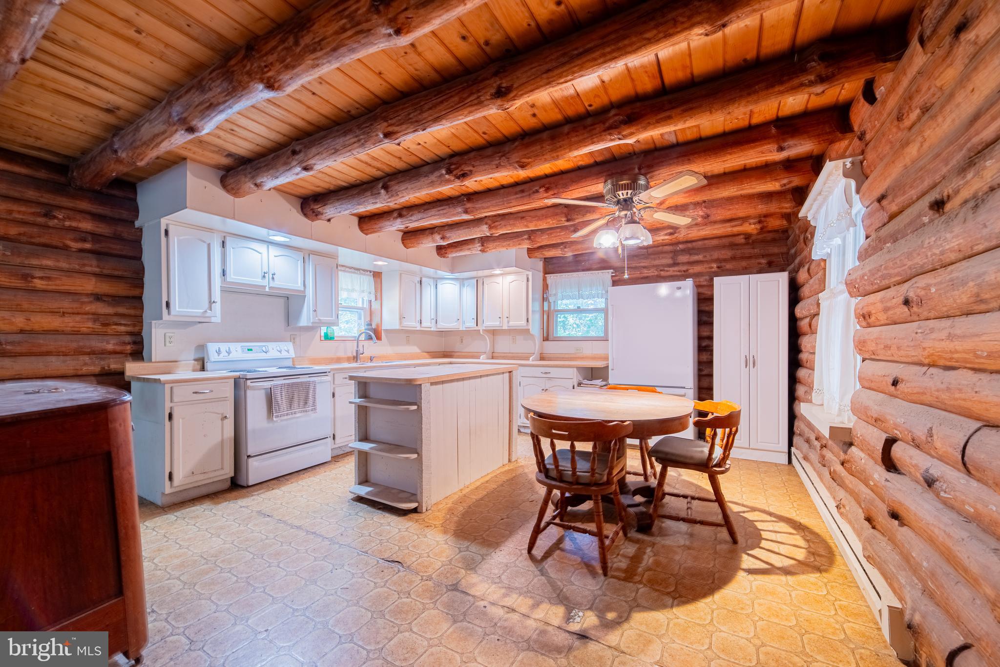 2 Oberlin Road Pennsville, NJ 08070 - Photo 8 of 12 a open kitchen with a table and chairs