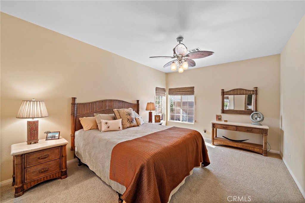 2710 Colorado River Road Blythe, CA 92225 - Photo 25 of 43 a bedroom with a bed and a chandelier