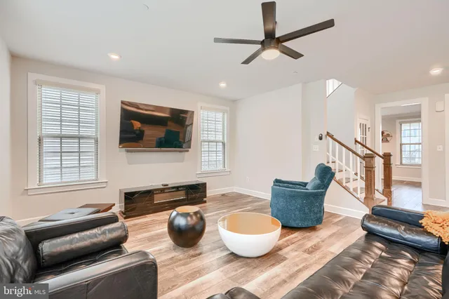 a large kitchen with kitchen island a sink stainless steel appliances and cabinets