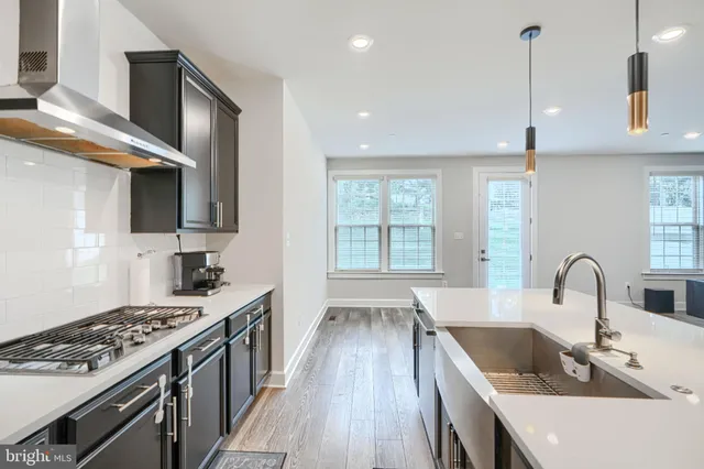 a utility room with cabinets washer and dryer