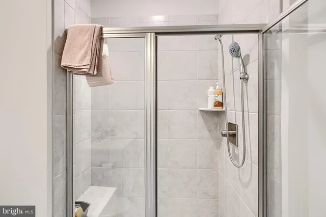 a bedroom with a bed and cabinets