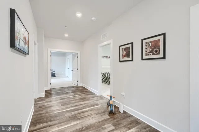 a spacious bathroom with a tub sink shower and a mirror