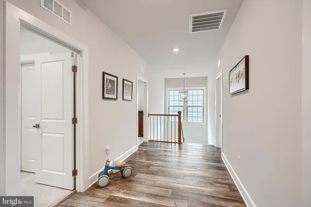 a white bath tub sitting next to a shower