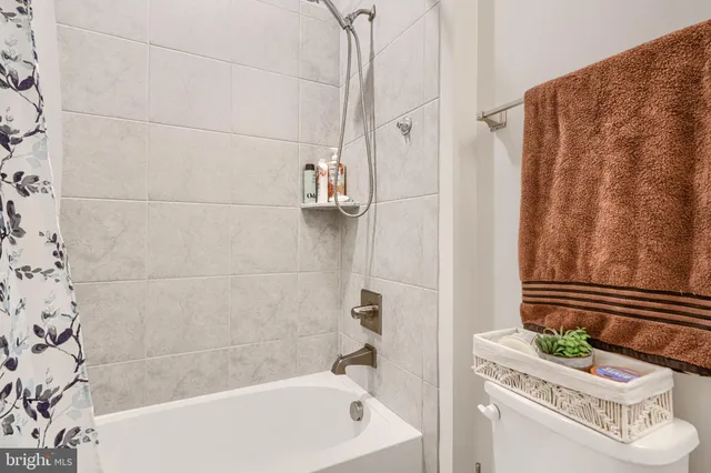 a front view of a house with a yard table and chairs