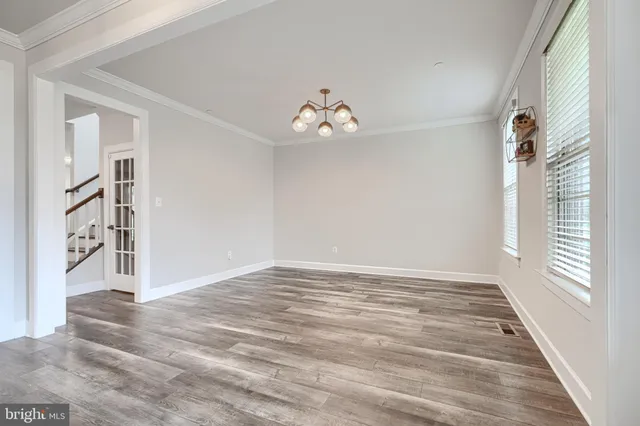 a view of livingroom with hardwood floor and a ceiling fan