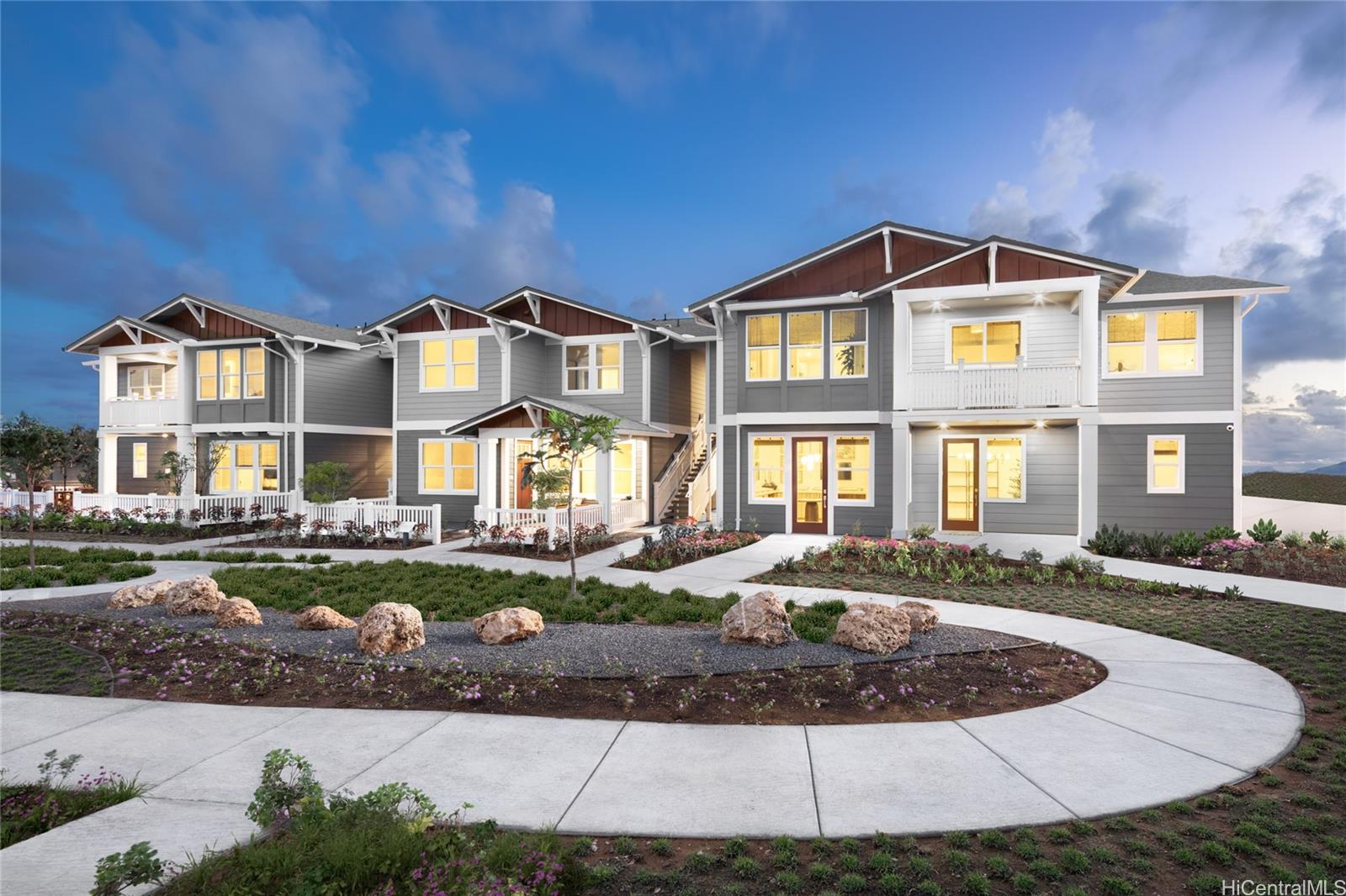 91-1101 Franklin D Roosevelt Avenue, Unit 363 Kapolei, HI 96707 - Photo 1 of 21 a front view of a residential apartment building with a yard