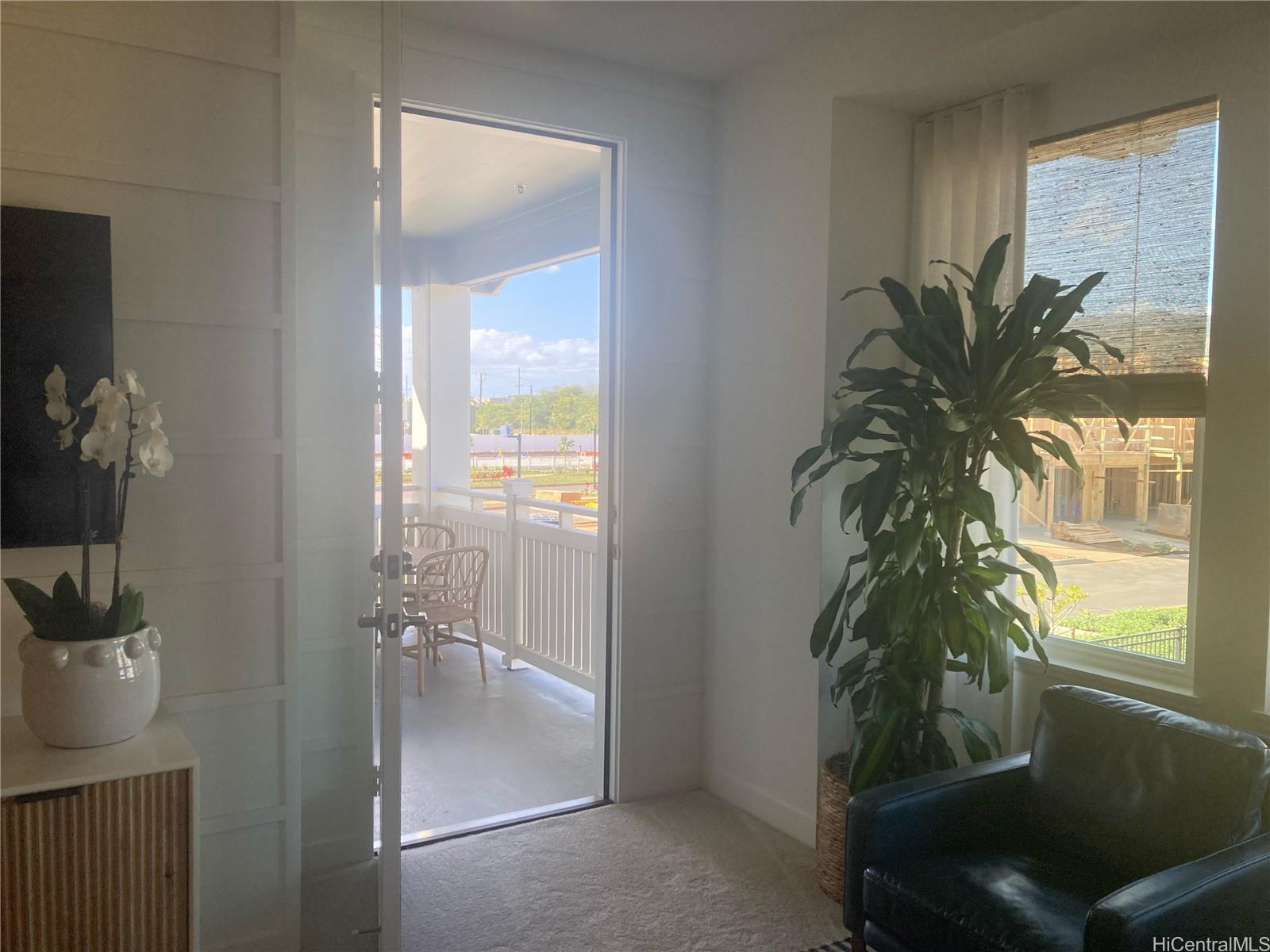 91-1101 Franklin D Roosevelt Avenue, Unit 363 Kapolei, HI 96707 - Photo 12 of 21 a potted plant in front of a room