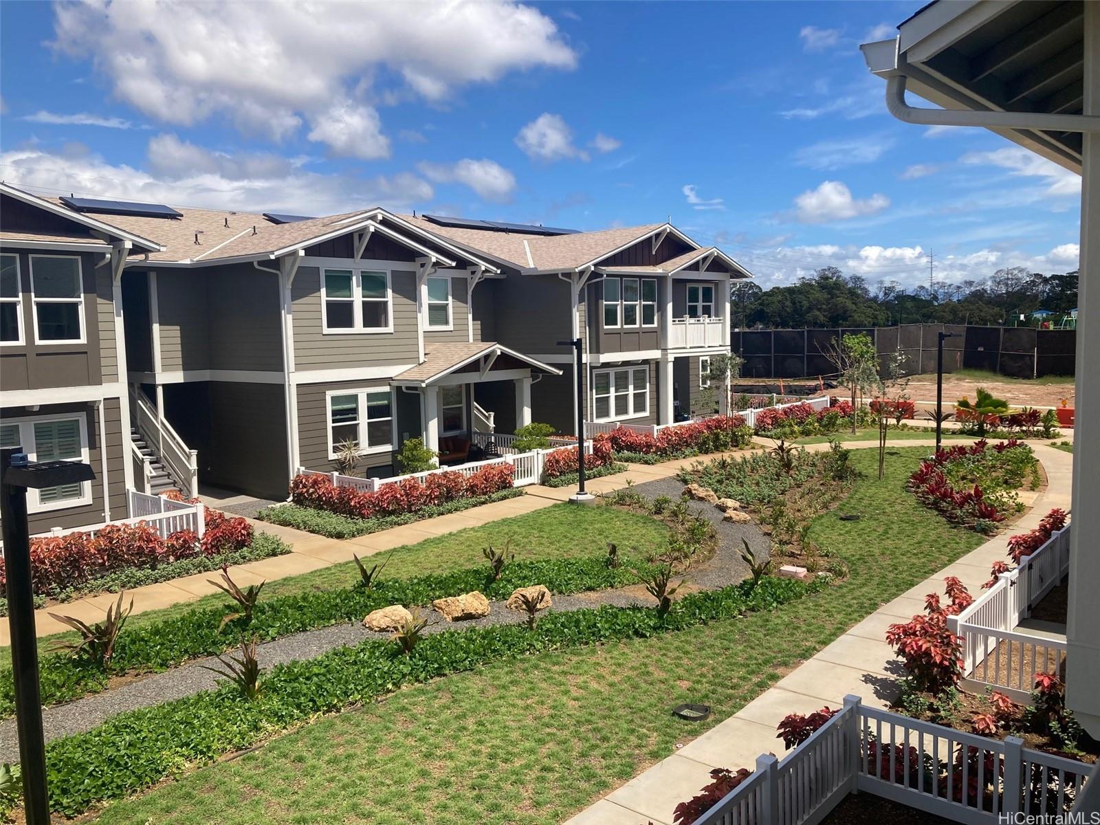 91-1101 Franklin D Roosevelt Avenue, Unit 363 Kapolei, HI 96707 - Photo 13 of 21 a front view of house with yard and green space