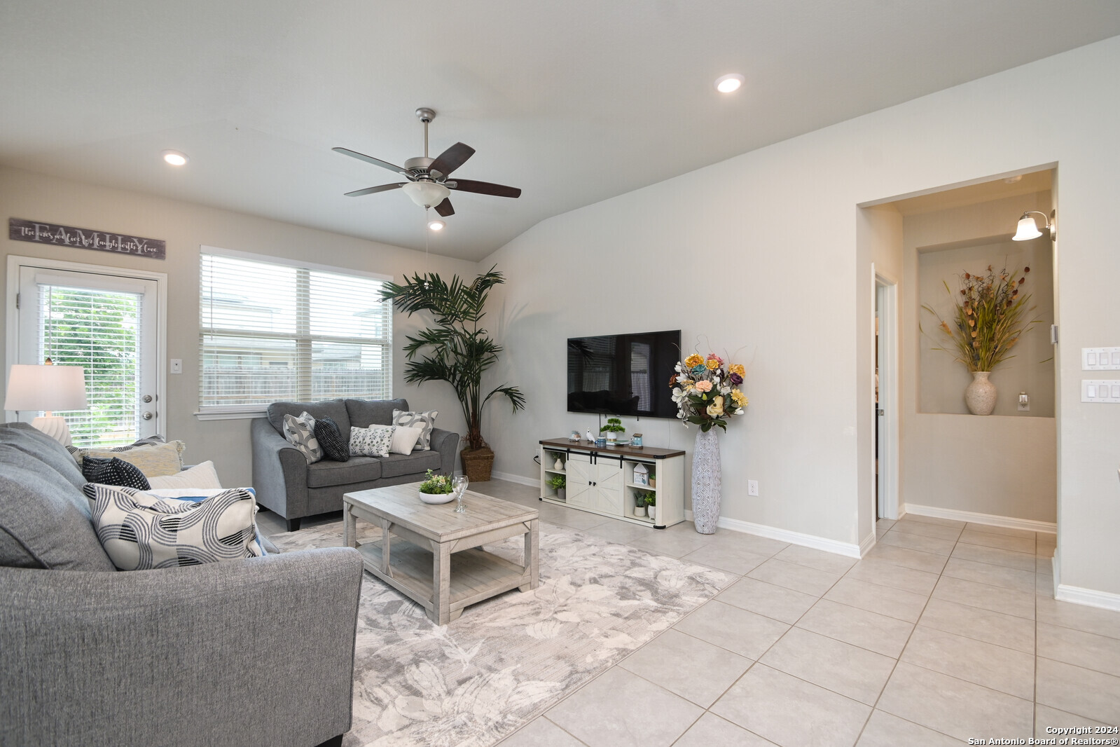 2411 Verona Way San Antonio, TX 78259 - Photo 13 of 22 a living room with furniture a flat screen tv and a large window