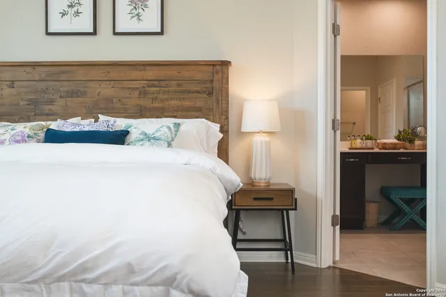 a bedroom with a bed and a table