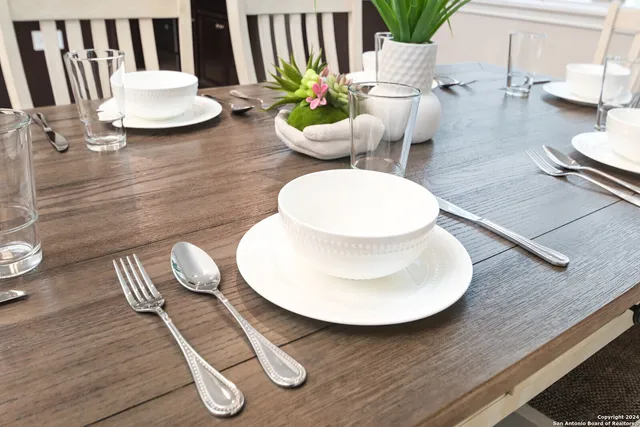 a kitchen with a table and chairs