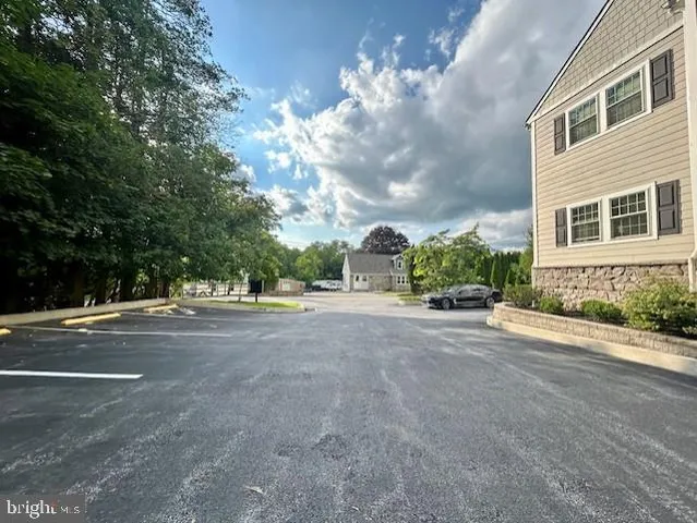 a view of a house with a street