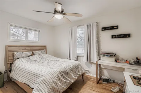 a bedroom with a bed and a table in it