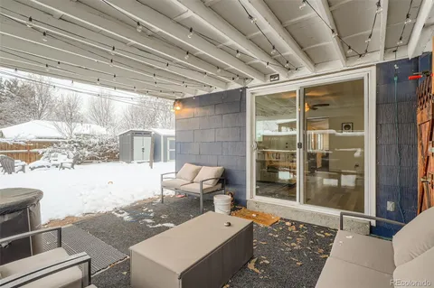 a view of house with yard and sitting area