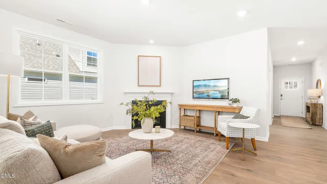 a dining room with furniture and wooden floor