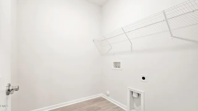 a view of a dining room with furniture and a potted plant