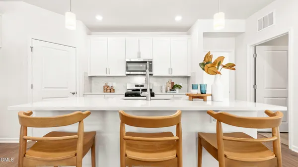 a bathroom with double sink and a mirror