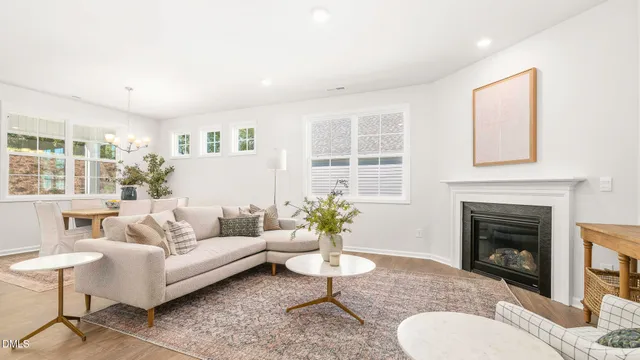 a view of a room with wooden floor and windows