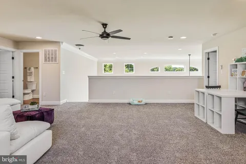 a bedroom with two beds and a lamp