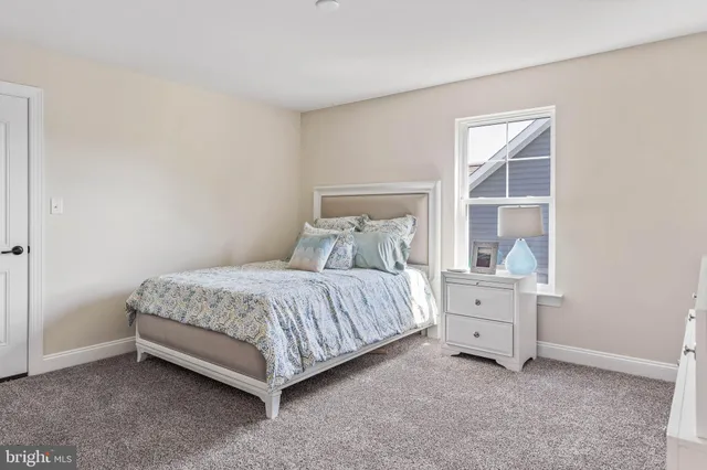 a view of storage and utility room with wooden floor