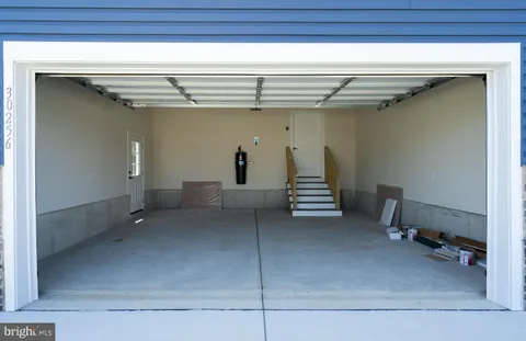 an aerial view of a houses with outdoor space and swimming pool