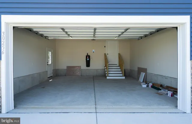 an aerial view of a houses with outdoor space and swimming pool