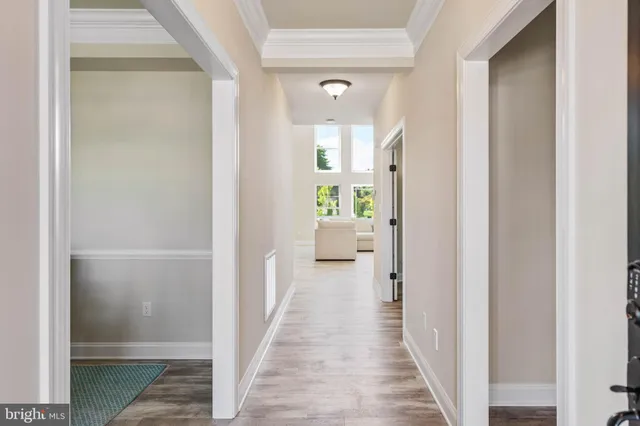 a view of a dining room with furniture and a chandelier