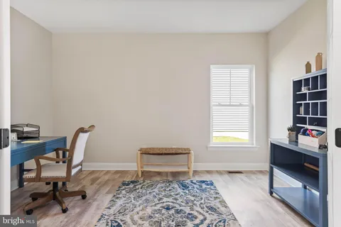 a workspace with furniture and a window