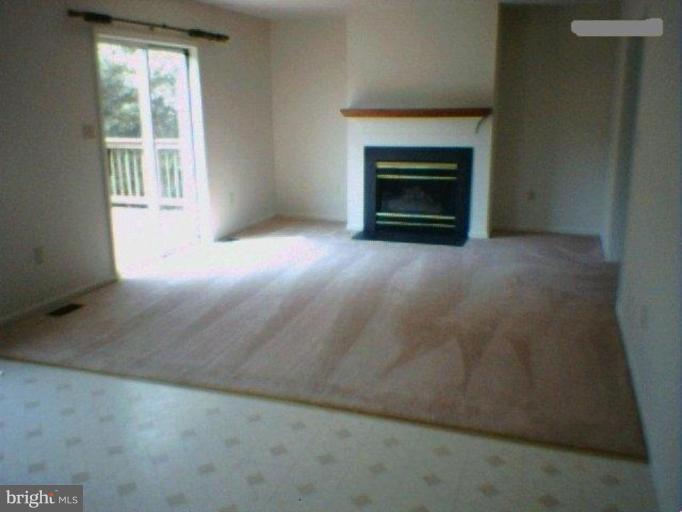 1604 Gibbons Court Point of Rocks, MD 21777 - Photo 5 of 9 Family room w/ fp & sliding doors to deck w/mtn vw