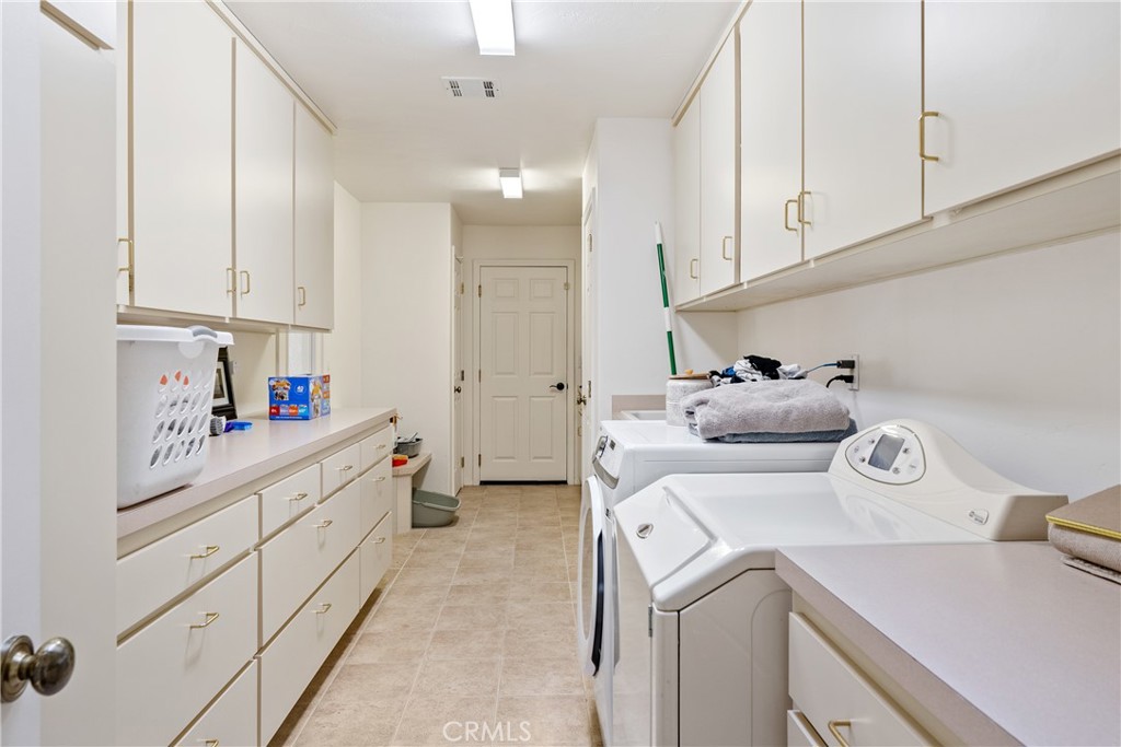 4342 Shadow Canyon Road Templeton, CA 93465 - Photo 59 of 74 Generous laundry room featuring extensive cabinetry and storage