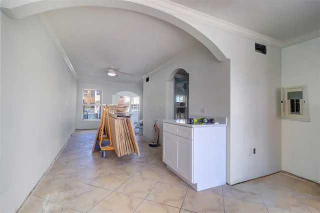 a kitchen with stainless steel appliances a refrigerator and a window