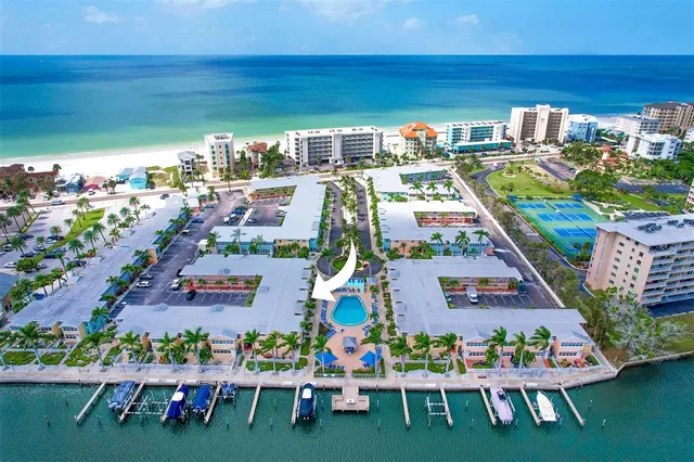 a view of swimming pool with outdoor seating and plants