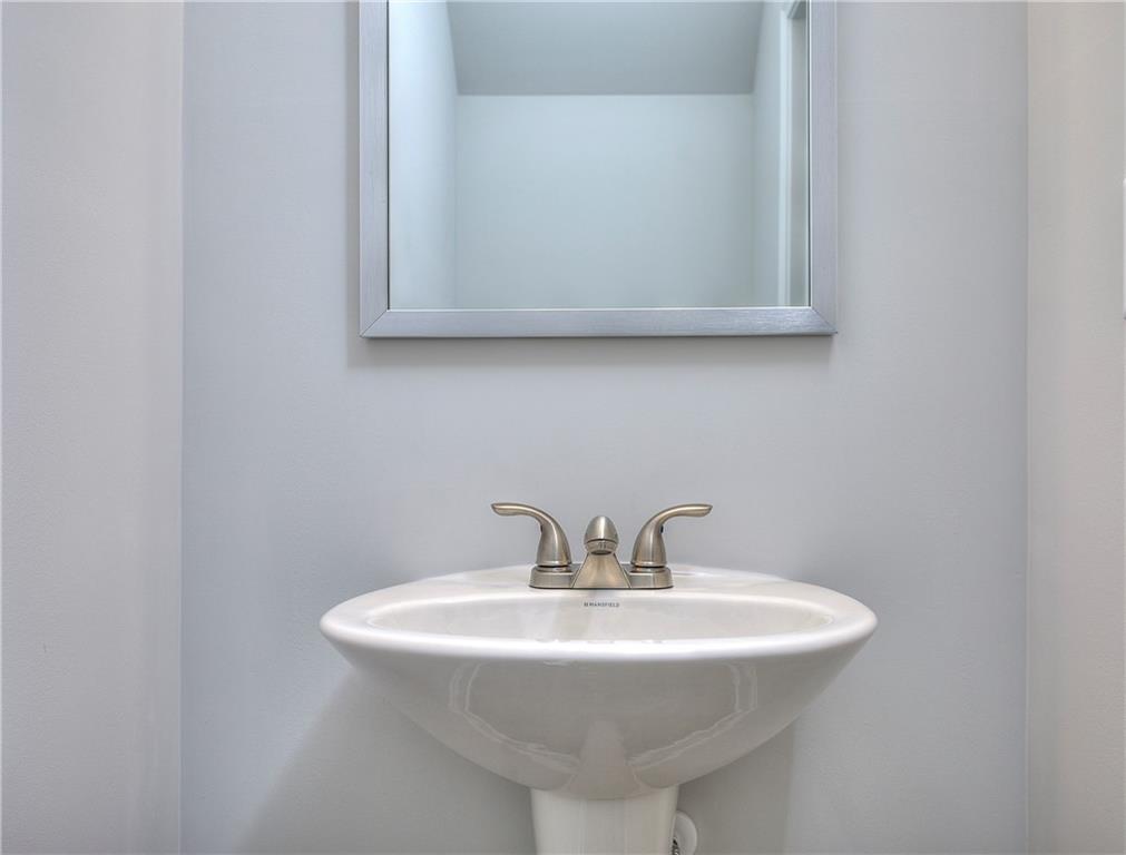 115 Greenview Court Homer, GA 30547 - Photo 18 of 32 a bathroom with a sink and a mirror