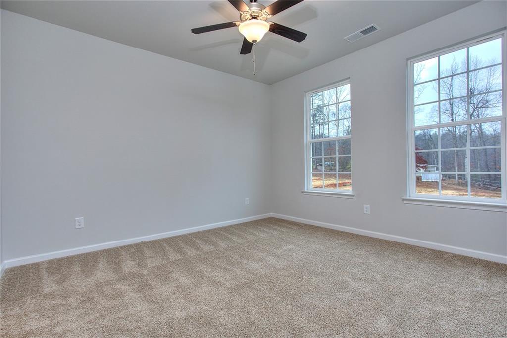 115 Greenview Court Homer, GA 30547 - Photo 20 of 32 wooden floor in an empty room with a window