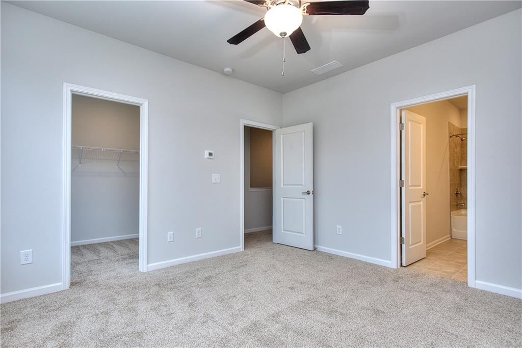 115 Greenview Court Homer, GA 30547 - Photo 21 of 32 a view of an empty room with a ceiling fan