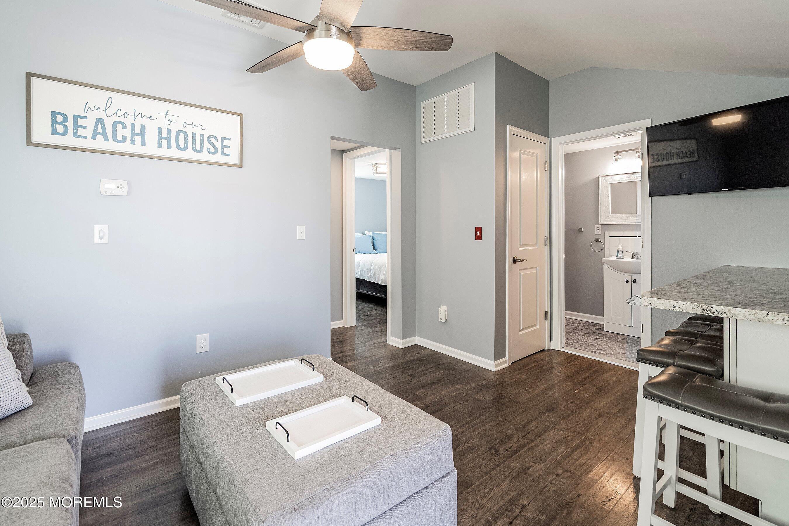 309 Hiering Avenue, Unit A Seaside Heights, NJ 08751 - Photo 10 of 18 a living room with furniture and a flat screen tv
