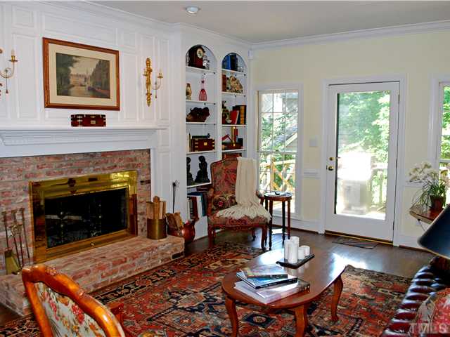 1306 Hampshire Court Raleigh, NC 27612 - Photo 2 of 12 a living room with furniture and a fireplace