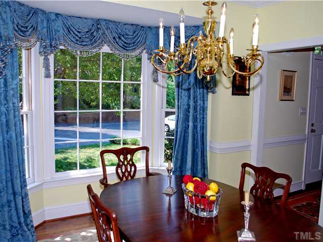 1306 Hampshire Court Raleigh, NC 27612 - Photo 5 of 12 a view of a dining room with furniture window and outside view