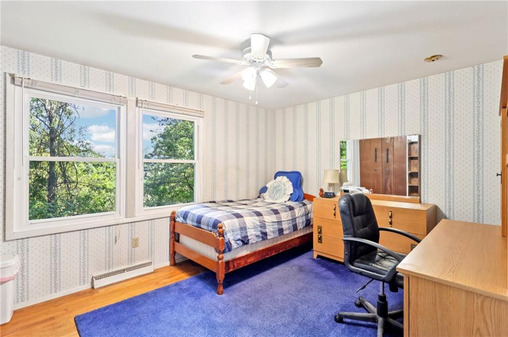 675 Blue Ridge Road Pittsburgh, PA 15239 - Photo 33 of 42 a bedroom with bed and a window