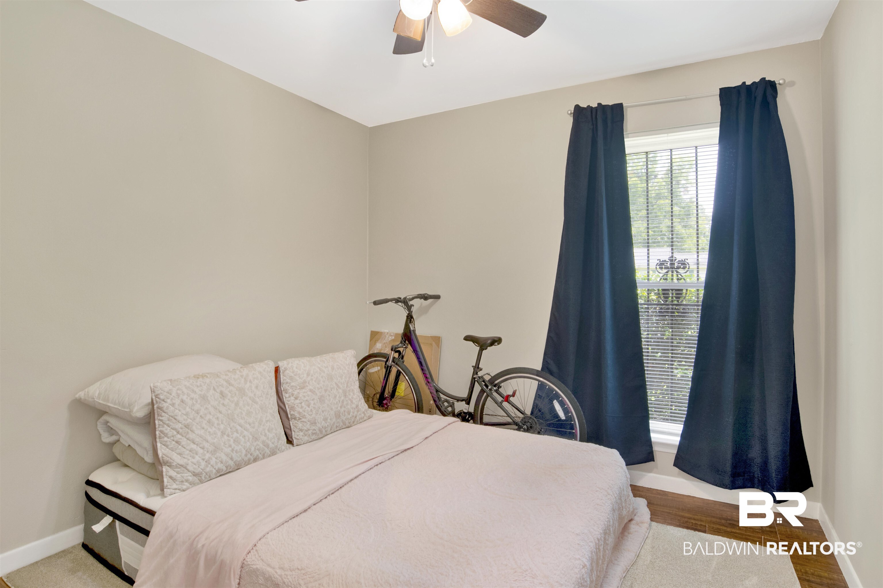 1476 Boudousquie Street Mobile, AL 36605 - Photo 22 of 34 Bedroom with ceiling fan and wood finished floors