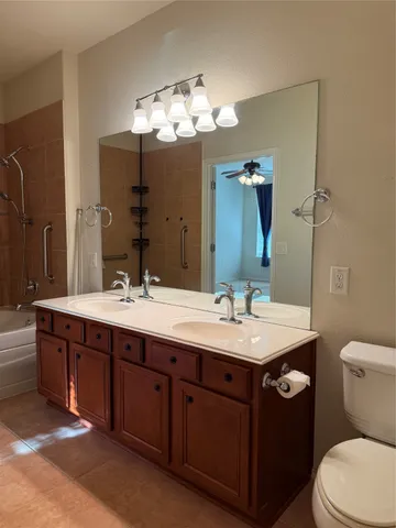 a bathroom with a double vanity sink and a mirror