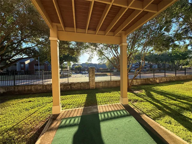 a view of a swimming pool with a patio