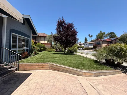 a view of backyard with sitting area