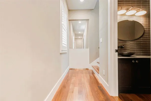 a view of a bathroom from a hallway