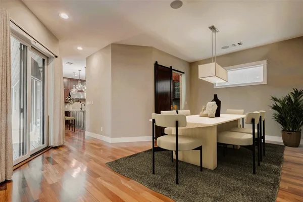 a view of a livingroom with furniture window and wooden floor