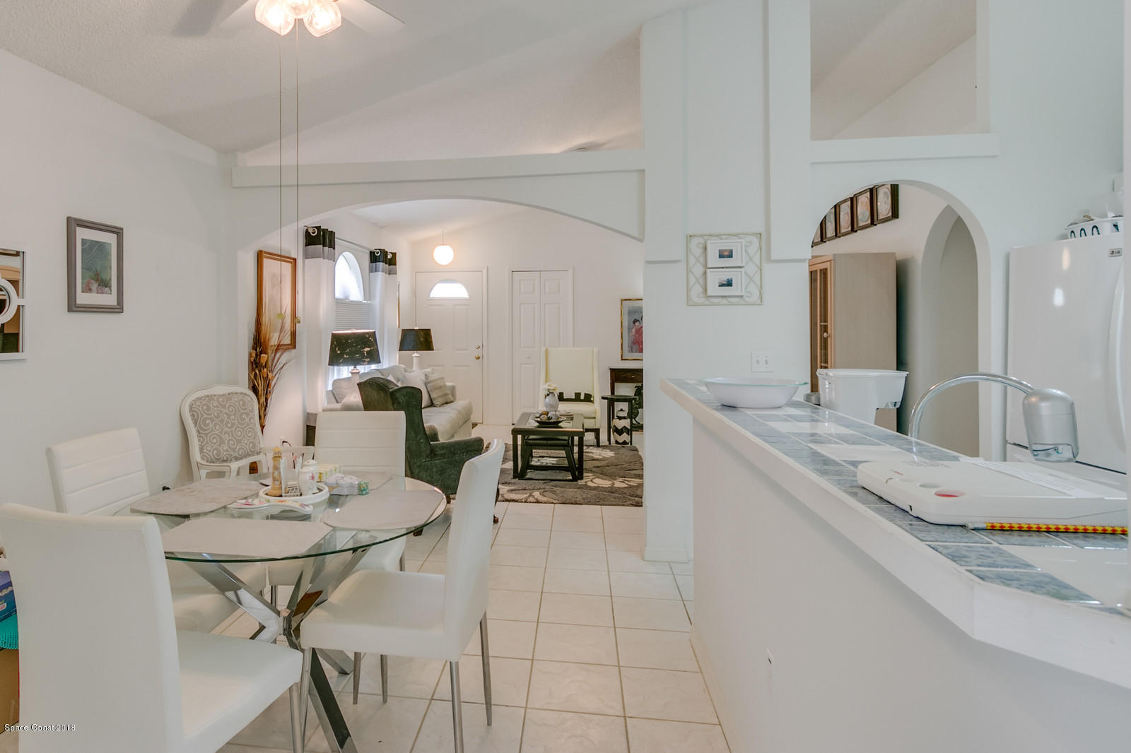 2009 Redwood Circle Palm Bay, FL 32905 - Photo 19 of 32 a kitchen with a sink a counter space and dining table